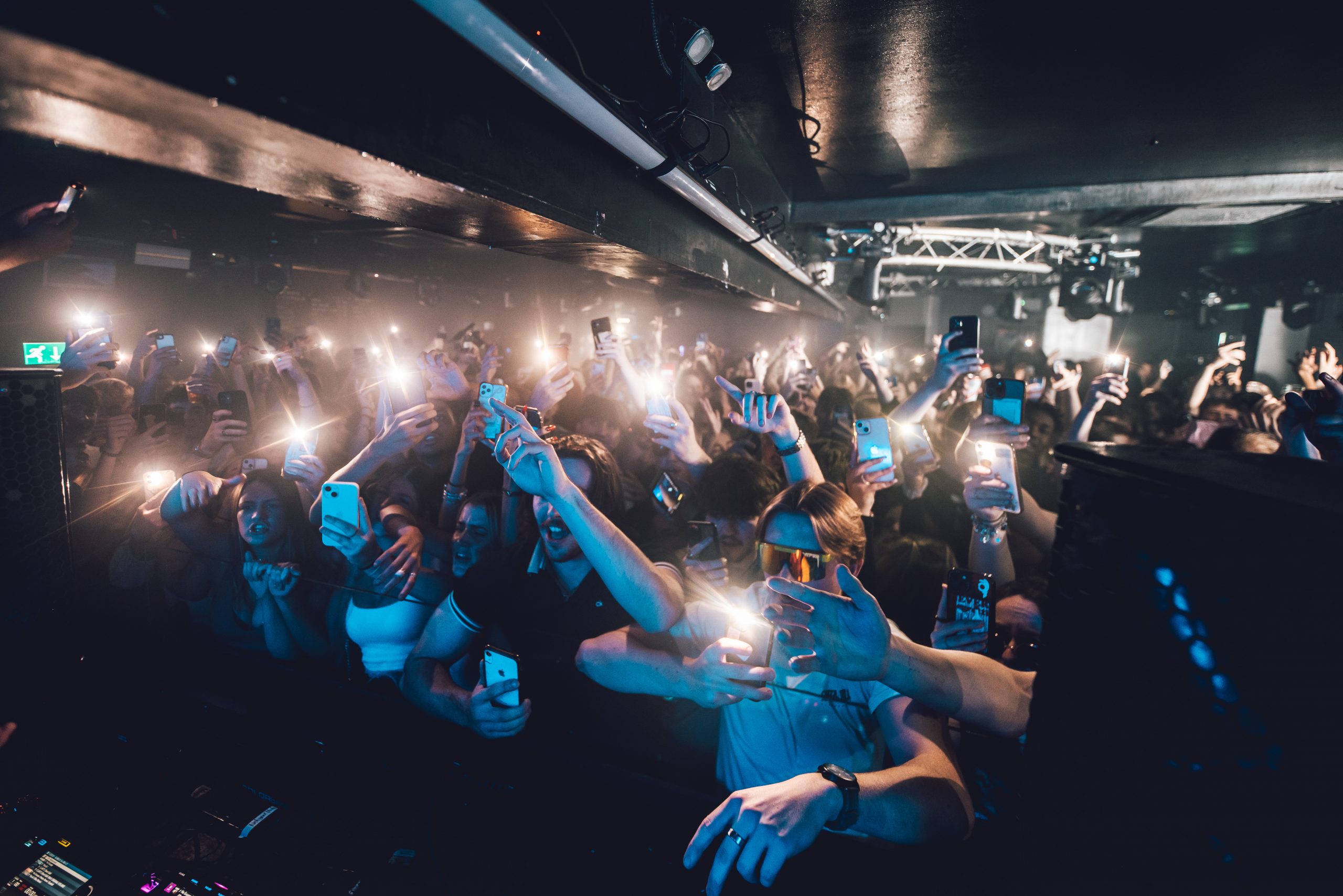 Vibrant crowd engaging at Stealth venue event, showcasing lively audience interaction.