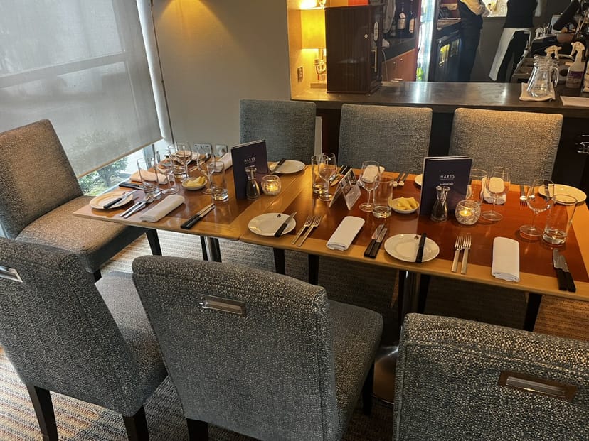 Elegant dining table setup in Hart's Kitchen for professional meetings and events.