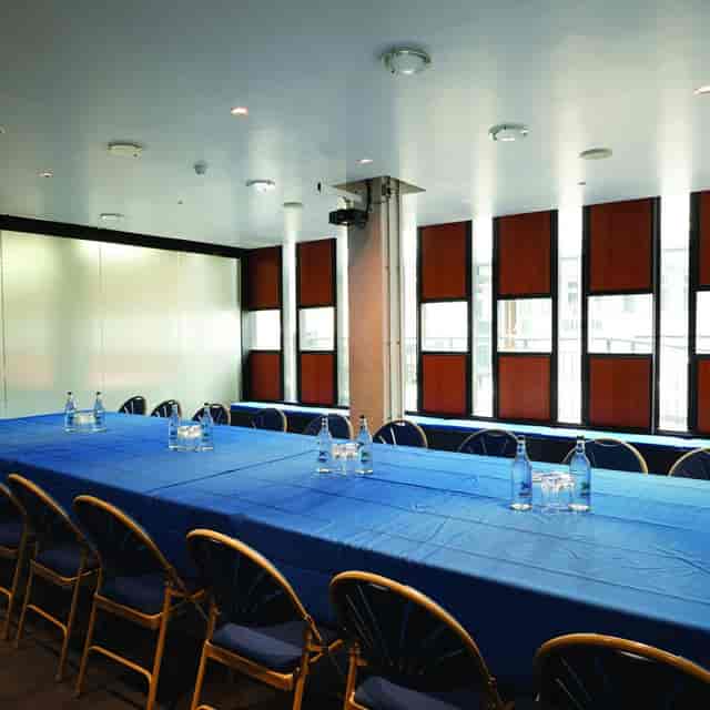 Ustinov Room at Nottingham Playhouse: modern meeting room with blue table, perfect for workshops.