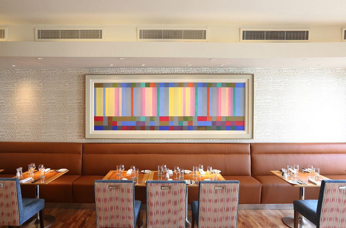 Modern dining area at Hart's Kitchen, perfect for corporate meetings and events. - Banner