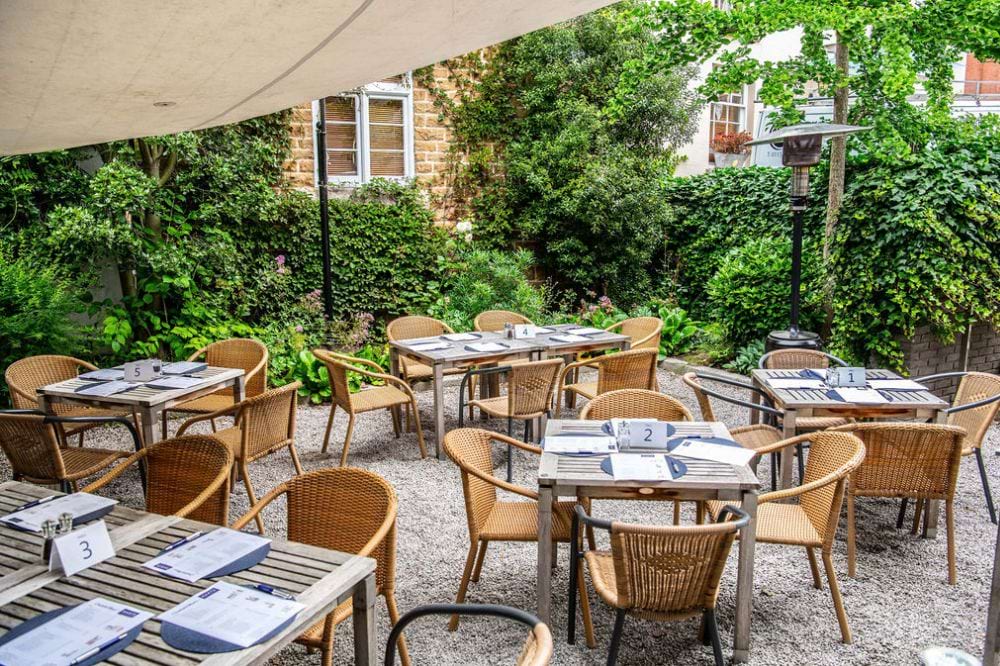 Outdoor dining area at Hart's Hotel, perfect for networking events and intimate gatherings. - Banner