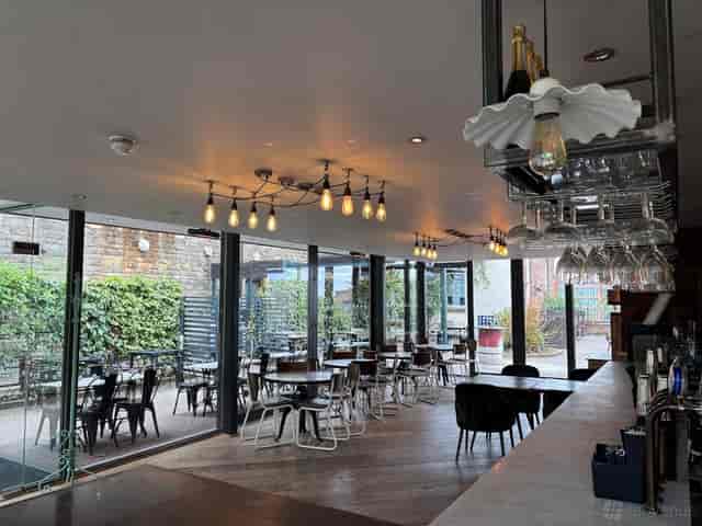 Terrace Bar at Pitcher & Piano: bright event space for gatherings and meetings.