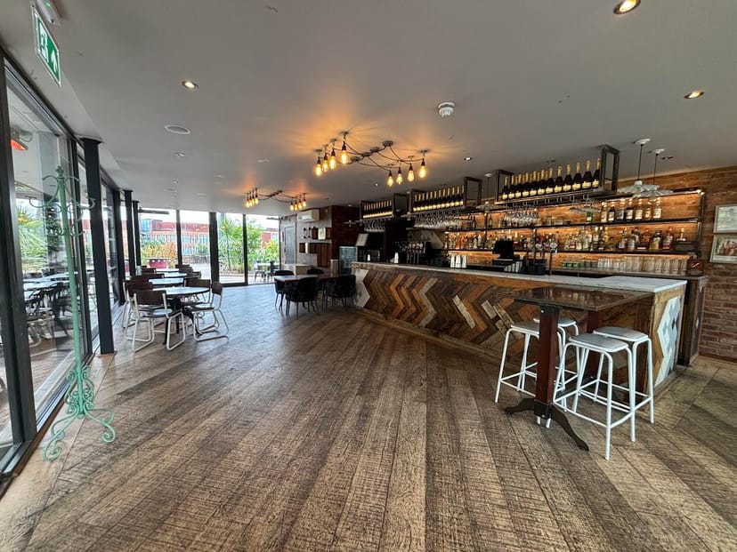Terrace Bar at Pitcher & Piano: modern venue with natural light for events and gatherings.