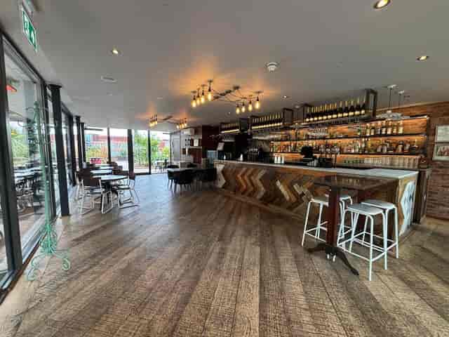 Contemporary Terrace Bar venue with wooden flooring, perfect for events and receptions.