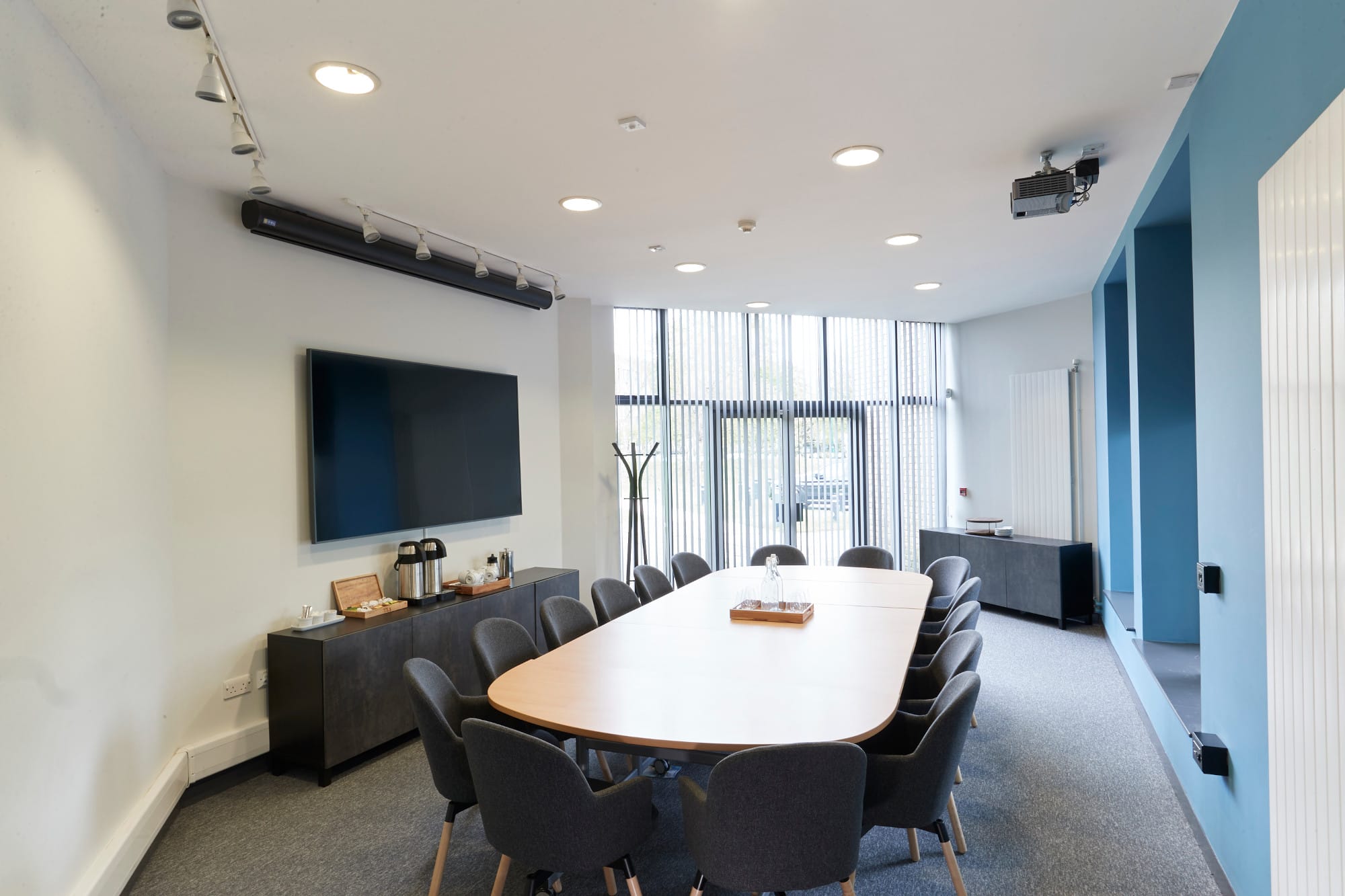 Modern conference room with long table at Lakeside Arts, ideal for meetings and events.