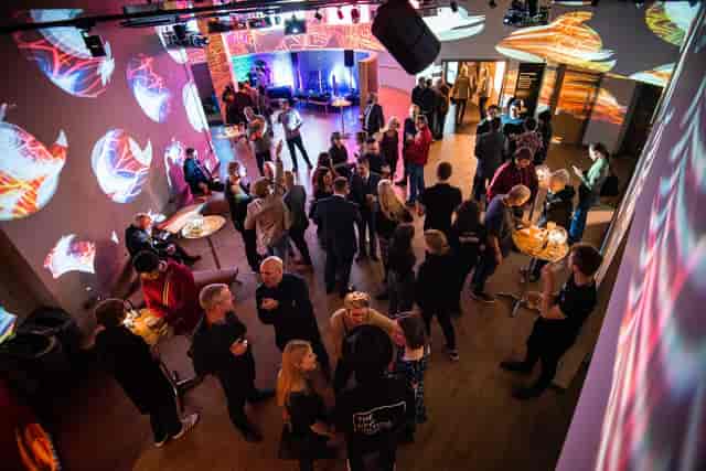 Vibrant Metronome Main Stage set for networking with modern lighting and visuals.