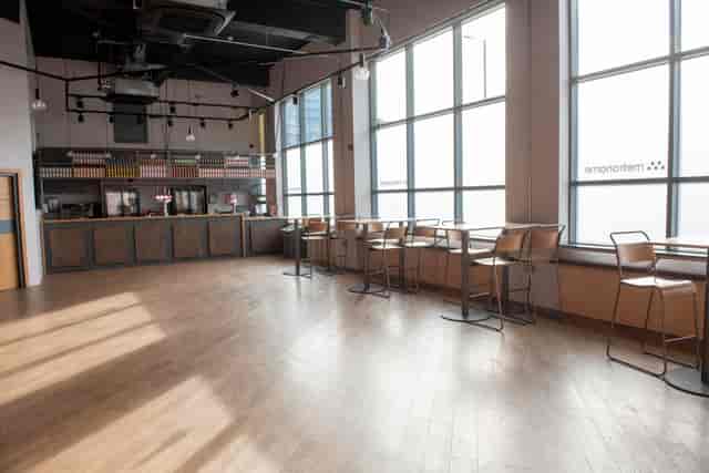 Modern event space with natural light, ideal for corporate gatherings and receptions.