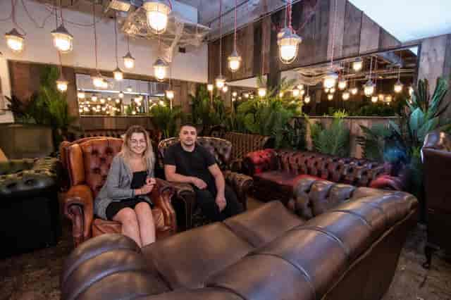 Cozy Bar & Atrium lounge with inviting leather seating for networking events.