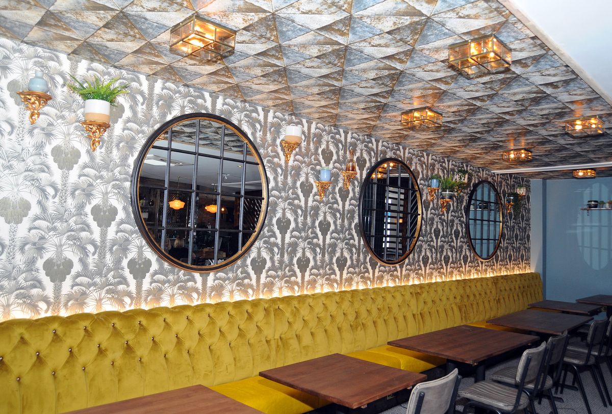 Stylish venue The Snug at The Refinery, plush seating for intimate events and meetings. - Banner