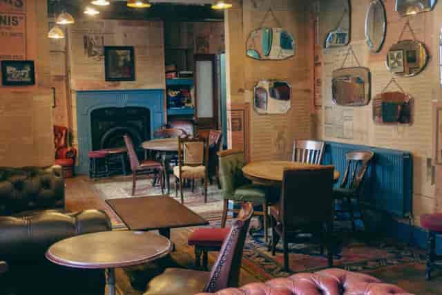 Cozy Chesterfield Lounge at Angel Microbrewery for intimate meetings and networking events.