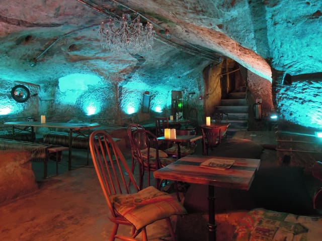 Bell Inn Cave Cellars with stone walls, perfect for intimate cocktail events and gatherings.