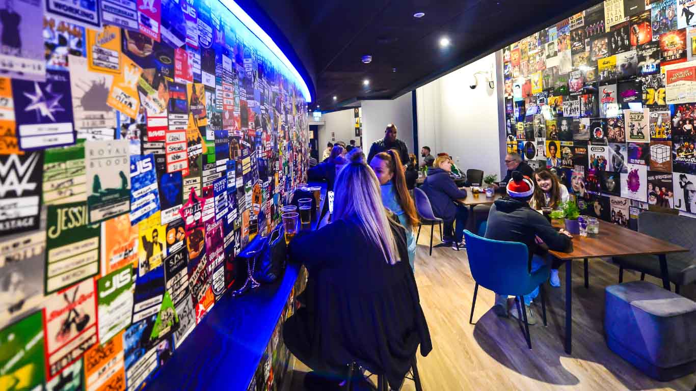 "Vibrant Bar 1946 at Motorpoint Arena for networking and social events, decorated with colorful memorabilia."
