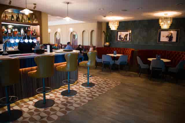 Bolero Suite at Motorpoint Arena: stylish event space with sleek bar for networking and gatherings.