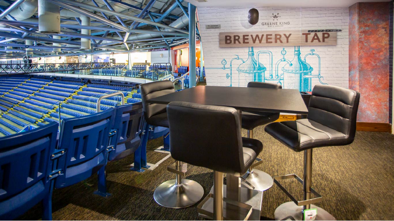 Stylish meeting space with black stools at Motorpoint Arena for corporate gatherings, Nottingham.