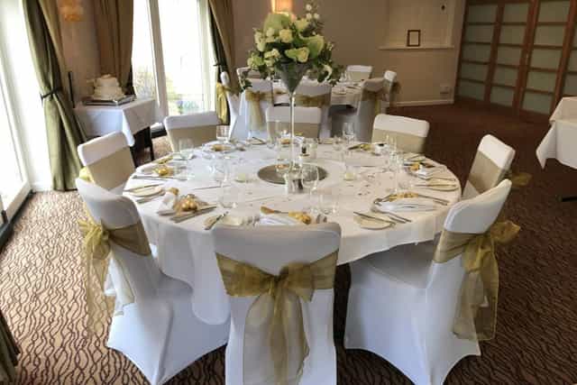 Function room banquet setup with round tables, perfect for wedding receptions and corporate events.