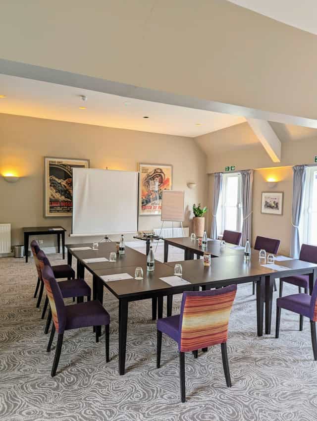Terrace Suite meeting room at Sudbury House Hotel, with central table and professional setup.