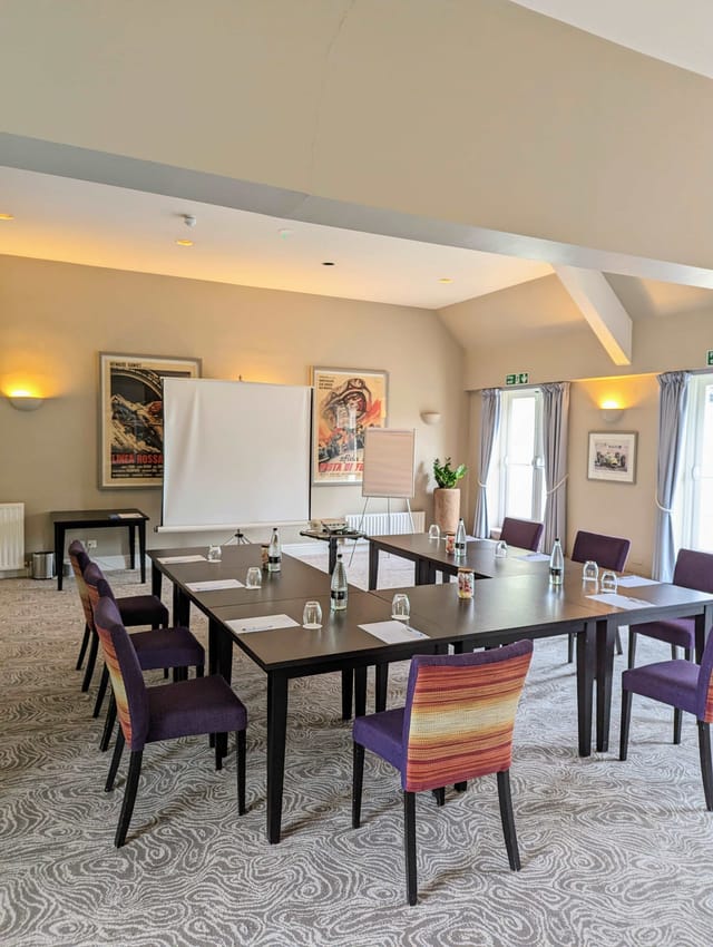 Terrace Suite meeting room at Sudbury House Hotel, with central table and professional setup.