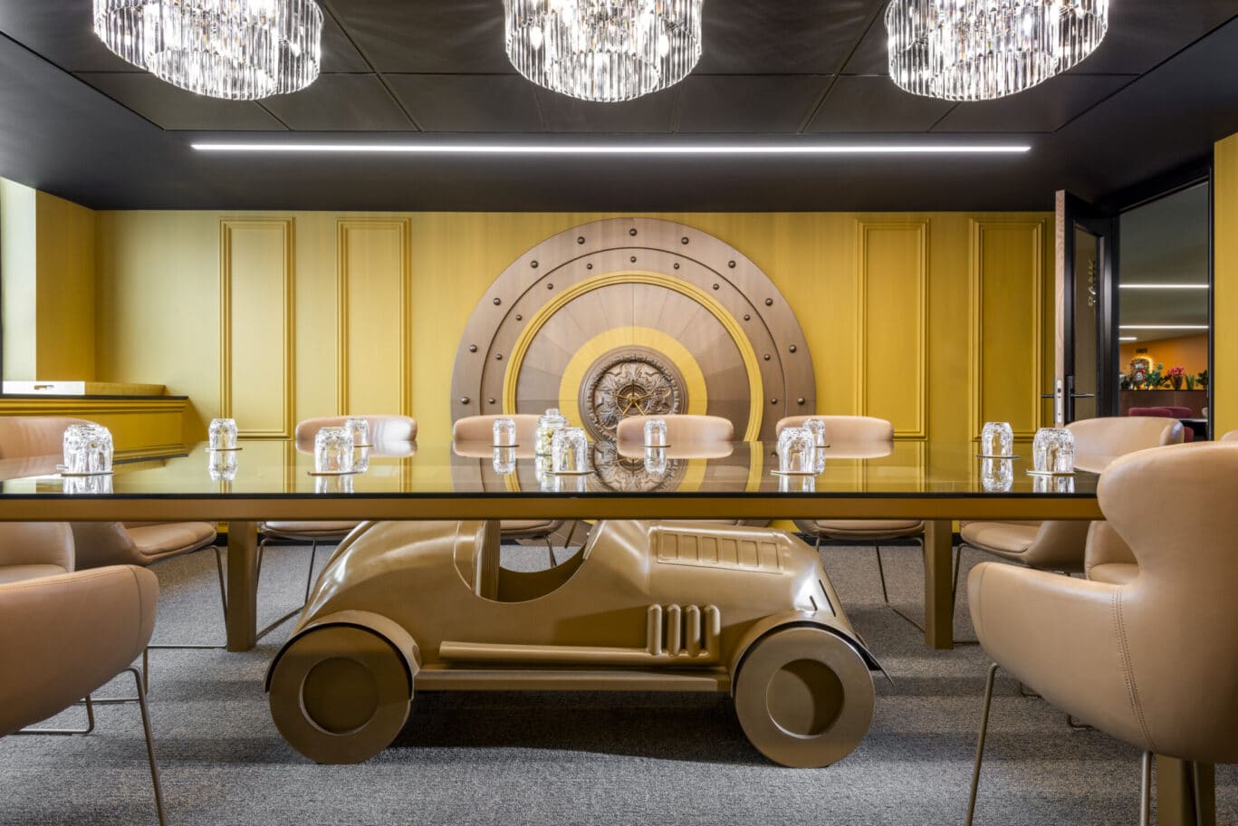 Innovative conference floor with car-shaped table for creative meetings and collaborations.