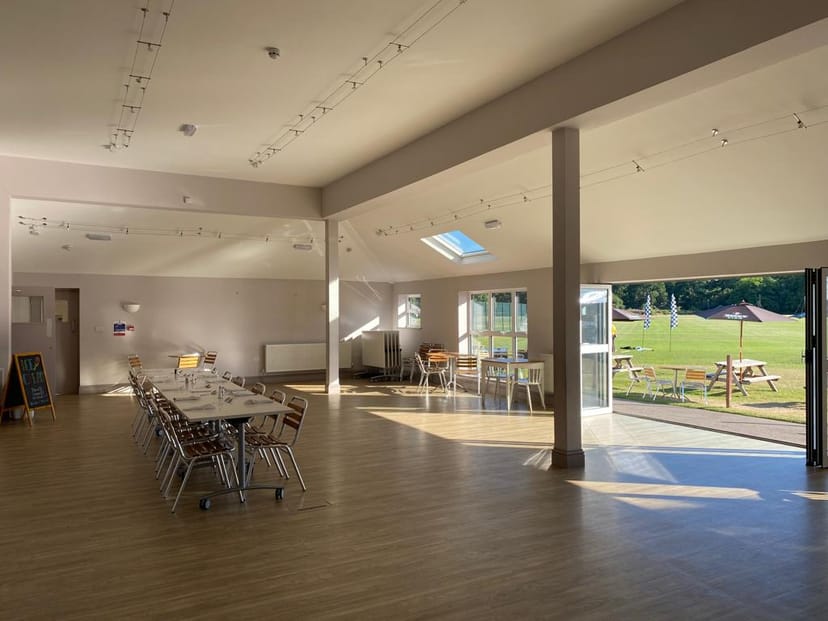 Bushy Park Sports Club Pavilion, spacious event venue with large windows for natural light.