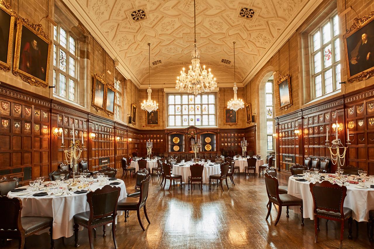 Elegant banquet hall with wood paneling, perfect for upscale events and formal dinners. - Banner