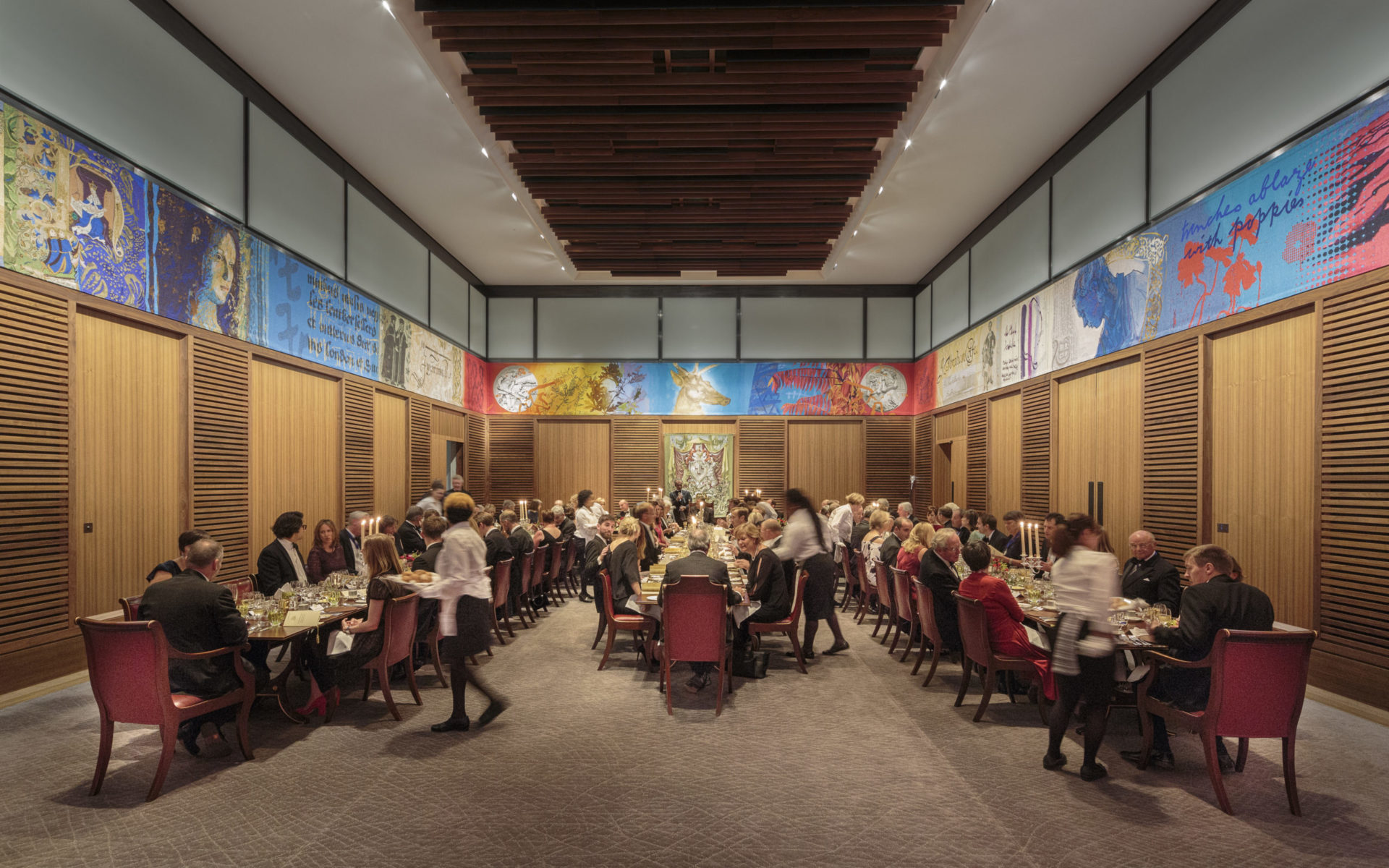 Elegant dining hall banquet with guests, murals, ideal for networking events. - Banner