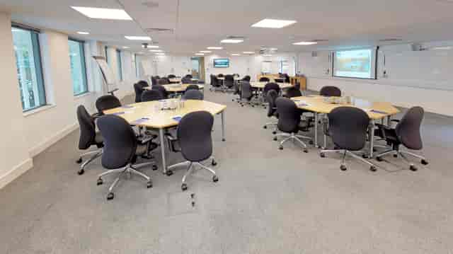 Conference Room with multi-pod layout for interactive workshops and corporate breakout sessions.