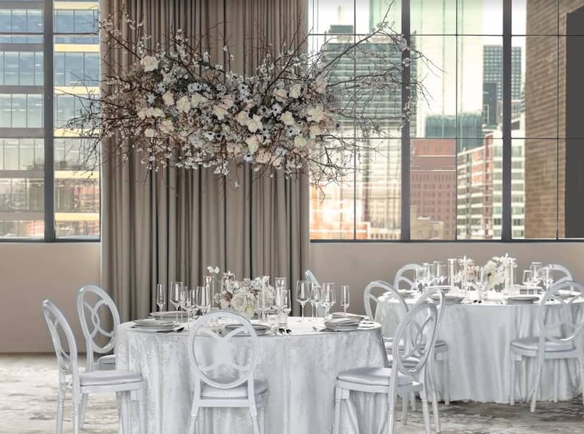 Kawa Ballroom event space with suspended floral installation for upscale corporate meetings.
