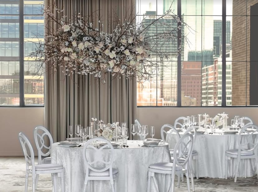 Kawa Ballroom event space with suspended floral installation for upscale corporate meetings.