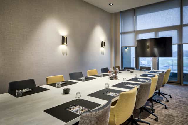 Modern multifunctional meeting room at Van der Valk Hotel Tilburg for corporate events and workshops.