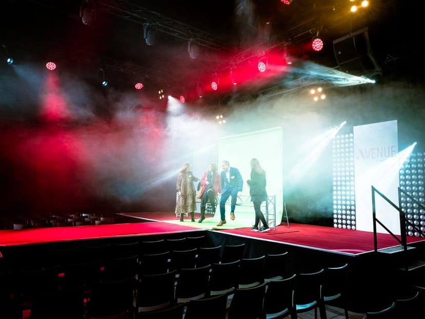 Dynamic stage setup with red lights for fashion show or corporate event at Avenue Blackbox.