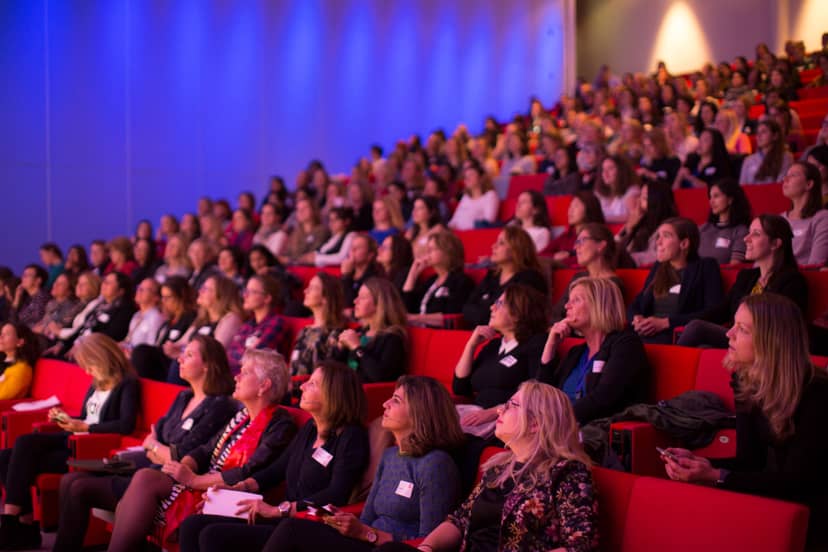 Packed Einstein Auditorium at High Tech Campus, vibrant lighting, effective event design.