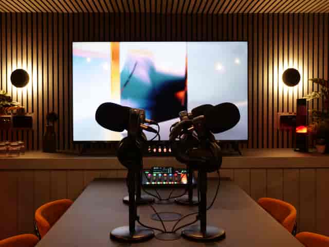 Modern podcast room with high-quality microphones for engaging virtual events.