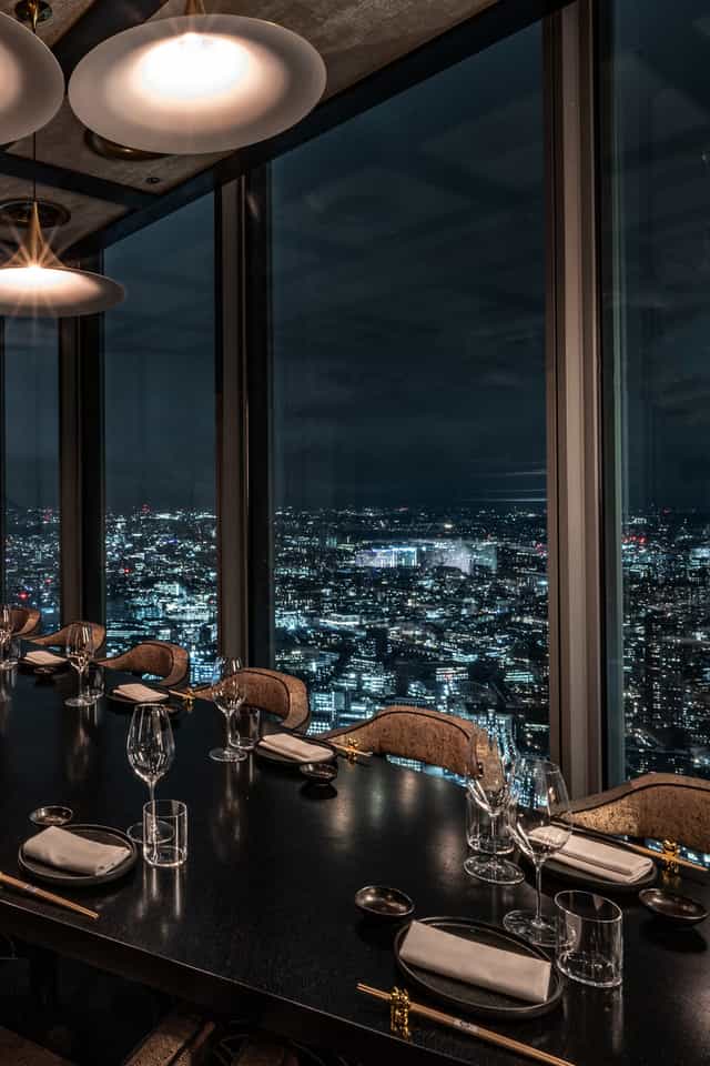 Private dining room at Lucky Cat Bishopsgate with cityscape view, ideal for corporate dinners.