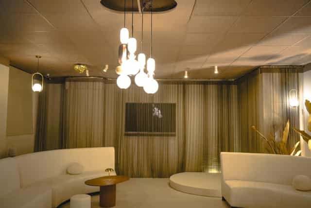 Luxury breakout lounge with plush curved seating for VIP networking and corporate events.