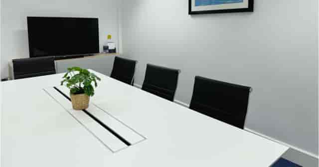 MYCO Ipswich meeting room, sleek table, presentation event