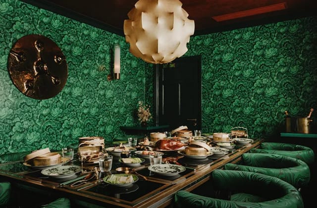 Private dining room at Maison Estelle with bold decor for VIP board meetings and networking events.