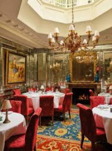 Luxury banquet room with ornate mirrors at Oswald's Club for high-stakes corporate dining events.