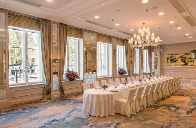 Elegant banquet room at Waldorf Astoria with stylish settings for corporate events.