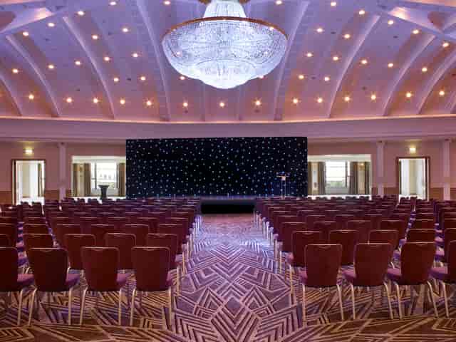 Belle Epoque ballroom with starlit backdrop for keynote presentation and awards gala.