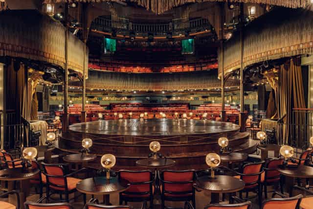 Haus of Cabaret private hire venue with circular stage for immersive keynote and dinner events.