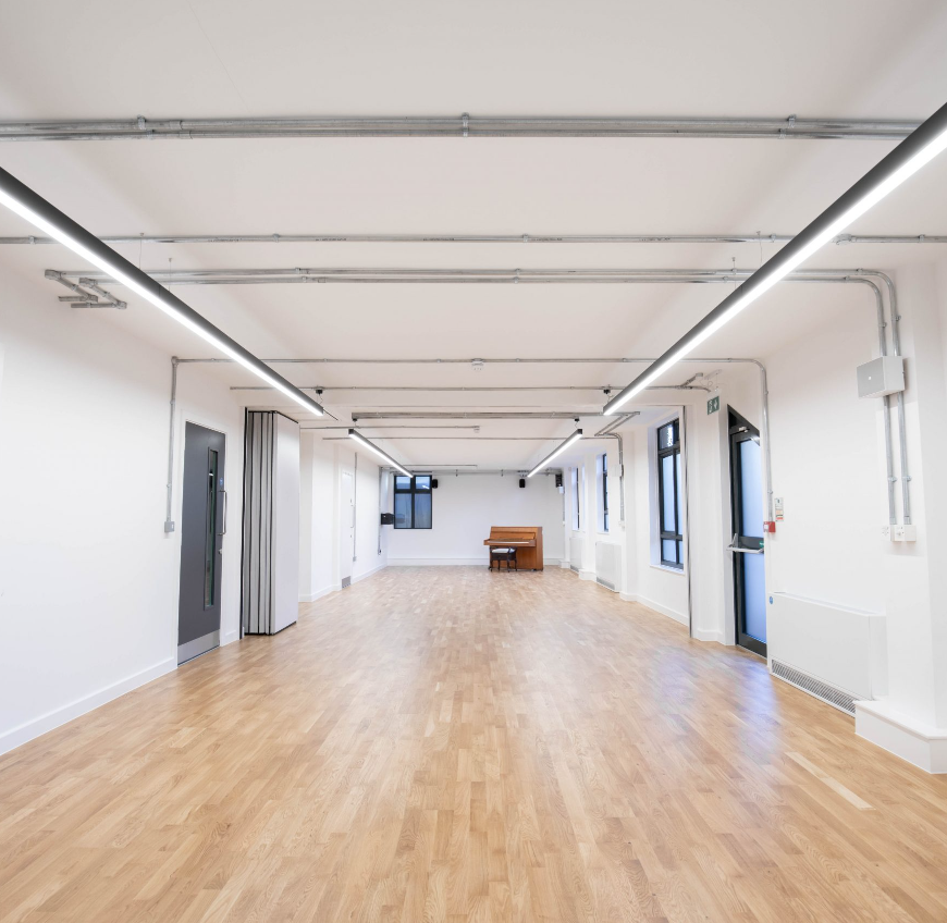 Versatile Studio 3 event space with polished floors, ideal for corporate meetings and workshops.
