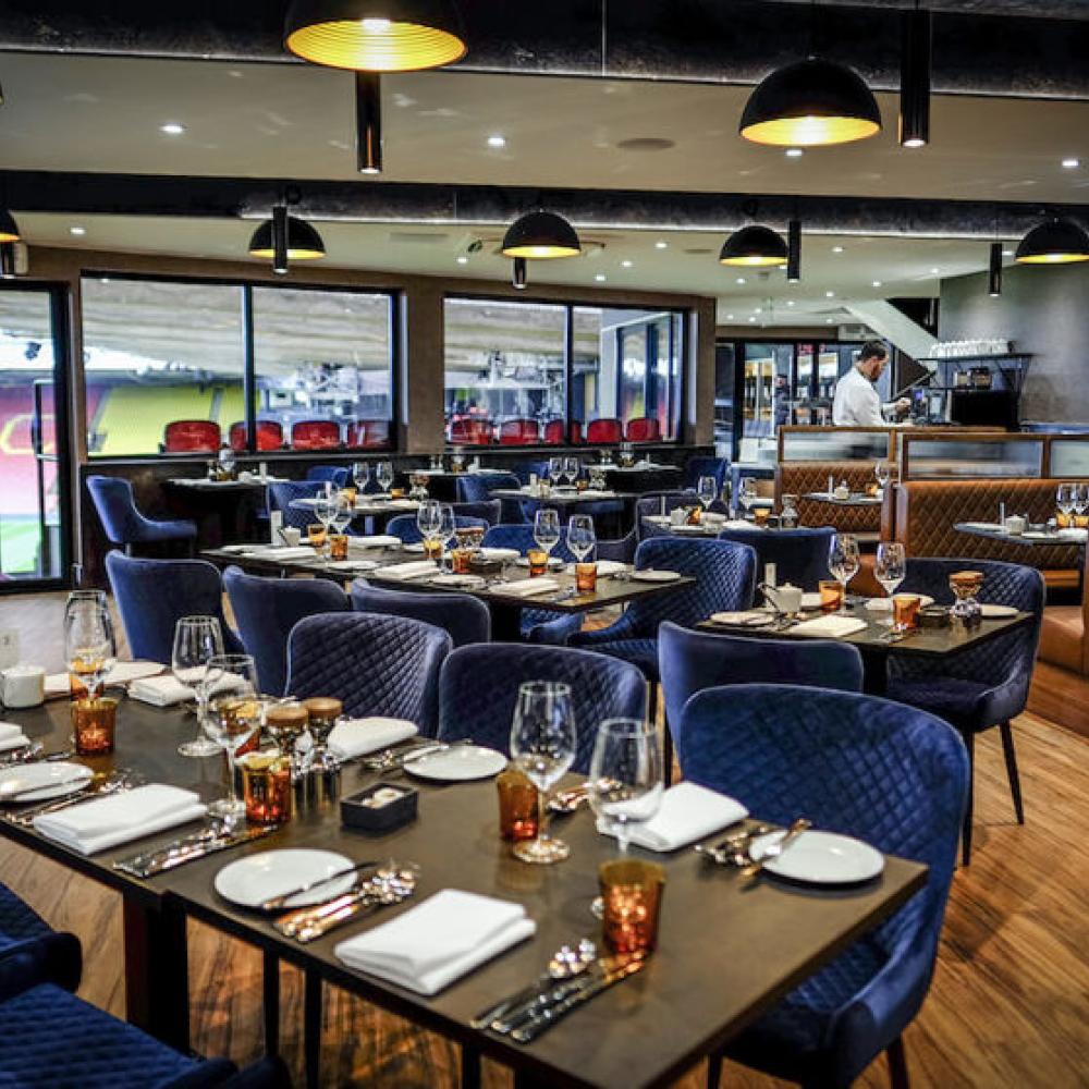 Elegant restaurant setup at Watford F.C. for corporate events and private gatherings. - Banner