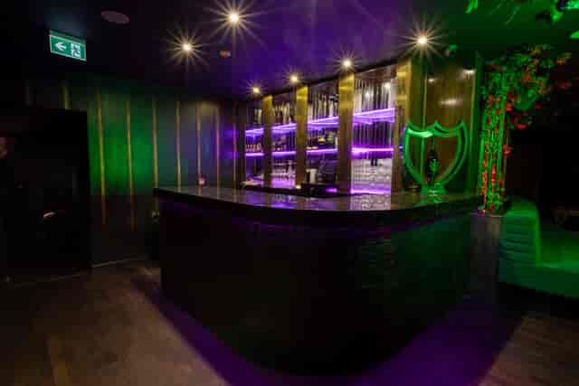 Helios Room bar at Selene Nightclub with vibrant lighting for cocktails or parties