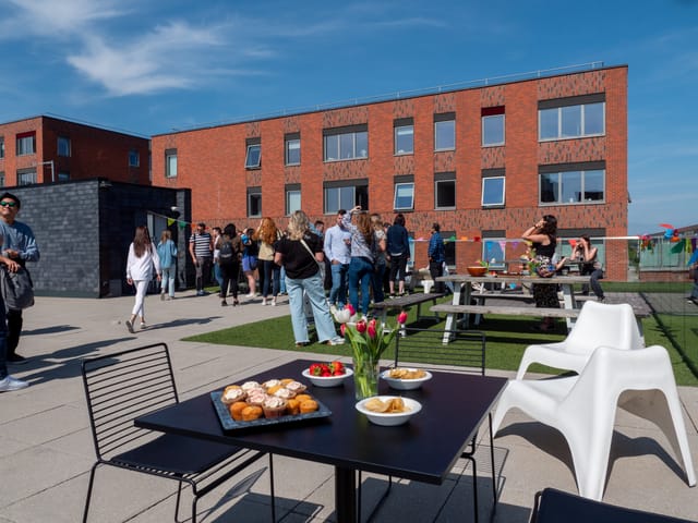 Networking event at Jactin Roof Terrace with modern architecture and inviting refreshments.