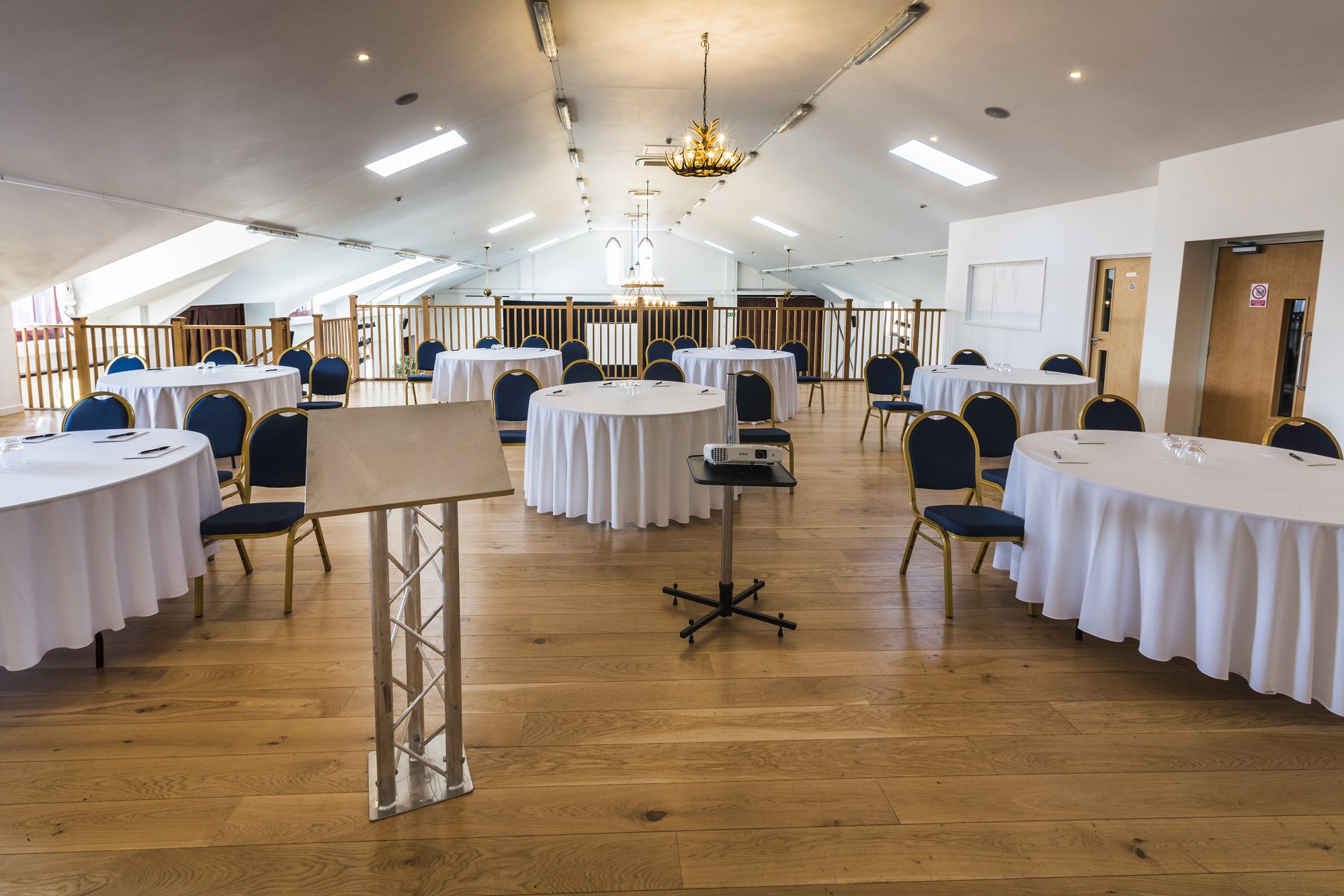 Hayloft Gallery: natural light, round tables, conference, event - Banner