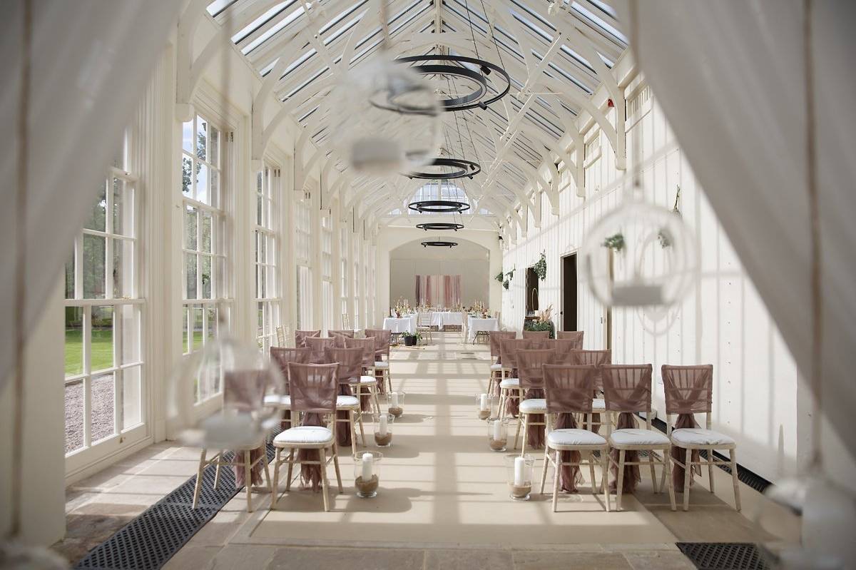 Conservatory wedding venue, natural light, elegant ceremony, luncheon
