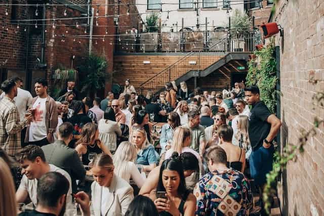 Outdoor beer garden networking event, summer reception, corporate gathering