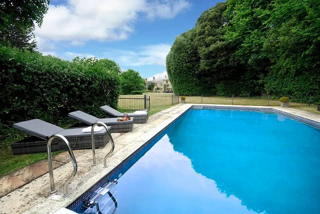 Serene poolside at Haygrass House, ideal for outdoor events and summer gatherings.