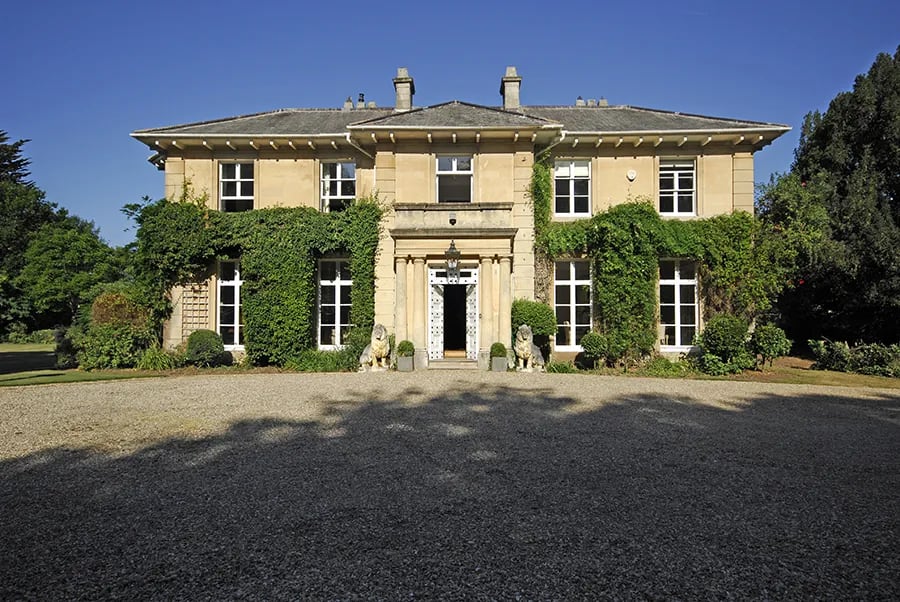 Elegant Haygrass House venue with lush greenery for corporate retreats and social gatherings.