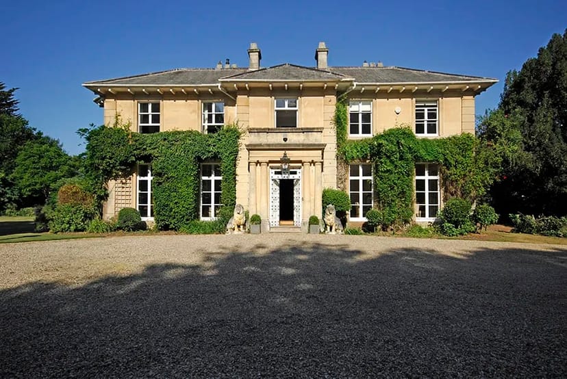 Elegant Haygrass House venue with lush greenery for corporate retreats and social gatherings.